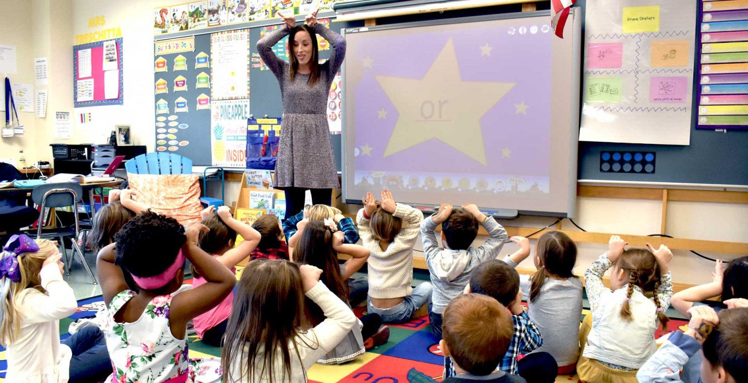 Phonics Consulting, Jolly Phonics Teacher working with children