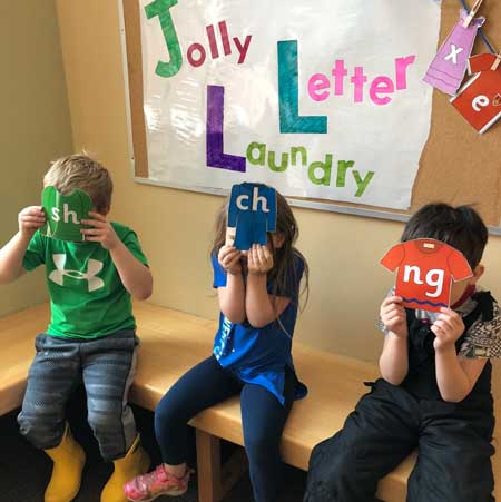 Children playing with letters